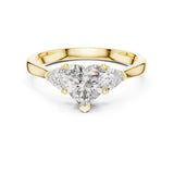 Front perspective of a romantic three stone engagement ring featuring a heart shape moissanite center with trillion side stones on a tapered 14k gold shank. Perfect for bridal jewelry lovers seeking personalized luxury. Custom choices available: 10k/14k gold, 925 silver, platinum metals with 1ct to 2ct sizes in moissanite or lab grown diamond.