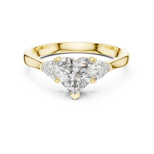Front perspective of a romantic three stone engagement ring featuring a heart shape moissanite center with trillion side stones on a tapered 14k gold shank. Perfect for bridal jewelry lovers seeking personalized luxury. Custom choices available: 10k/14k gold, 925 silver, platinum metals with 1ct to 2ct sizes in moissanite or lab grown diamond.