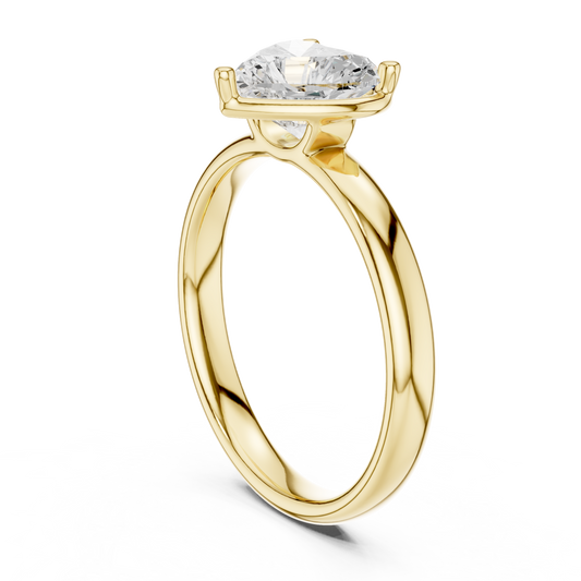 Three-quarter angle highlighting the crisp lobes and brilliant facet fire of a 1.50Ct heart cut lab diamond or moissanite (Colorless D-E, VVS). Displays an open wire gallery basket with dedicated V-prongs and round claw prongs on a substantial 2.71mm wide by 1.58mm thick shank. Modern romantic aesthetic engineered for daily durability in 10k/14k gold, silver, or platinum.