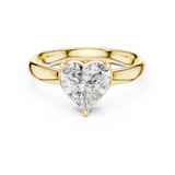 Direct top view showcasing a 1.50Ct (7.50x7.50mm) heart brilliant cut lab grown diamond or moissanite (Colorless D-E, VVS clarity) securely held in a 3-prong solitaire wire basket with a protective V-tip. Set on a solid 2.71mm wide comfort-fit shank in polished gold. Minimalist, romantic design customizable from 1.00Ct to 2.00Ct in solid gold, silver, or platinum.
