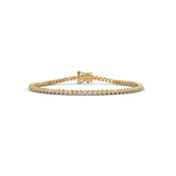 Round brilliant cut moissanite tennis bracelet set in 14k solid gold displaying 80 stones in smooth bezel cup mounts. Articulated link alignment delivers radiant bridal jewelry sparkle for an anniversary gift. Available custom in 10k/14k gold, 925 silver, platinum, stone sizes 1ct to 10ct tcw, and stone variation moissanite or lab grown diamond.