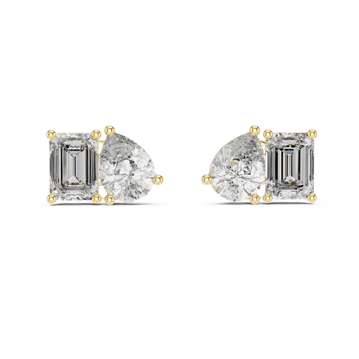 Direct front view displaying pear and emerald cut stones paired in a modern toi et moi layout. Ideal statement studs or anniversary gifts in 14k gold, 10k gold, 925 silver, or platinum. Customizable stone options with moissanite or lab grown diamond.