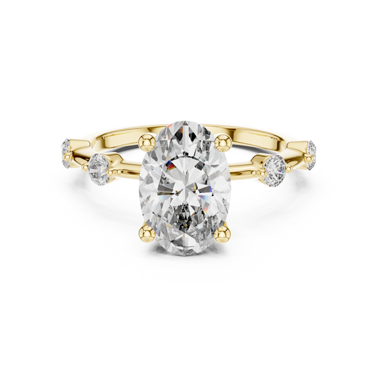 Front direct view of 2.00ct elongated oval lab diamond held by four prongs with round shoulder accents on a 14k gold dainty band. Ideal modern engagement ring and personalized gift. Made to order in 925 silver, 10k or 14k solid gold, platinum, with custom 1ct to 2ct lab diamond or moissanite center stones.