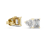 Front view of Toi et Moi stud earrings showcasing side-by-side heart and emerald stones in collet basket prong settings. Features radiant 4.00ctw gems mounted in lustrous 14k gold. Ideal engagement ring companion or bridal gift. Available in 10k/14k solid gold, 925 silver, platinum, from 1ct to 2ct in custom lab grown diamond or moissanite.