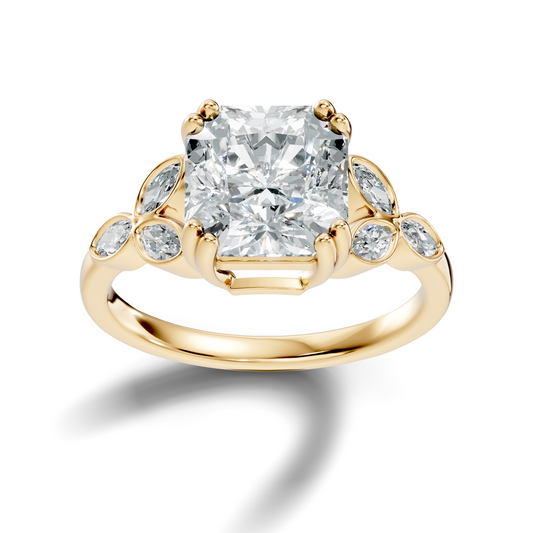 Front view highlighting a radiant cut moissanite center stone secured with double claw prongs and accented by botanical marquise leaf side clusters in 14k gold. A personalized engagement ring available in 10k/14k gold, 925 silver, or platinum with 1ct to 2ct moissanite or lab grown diamond.