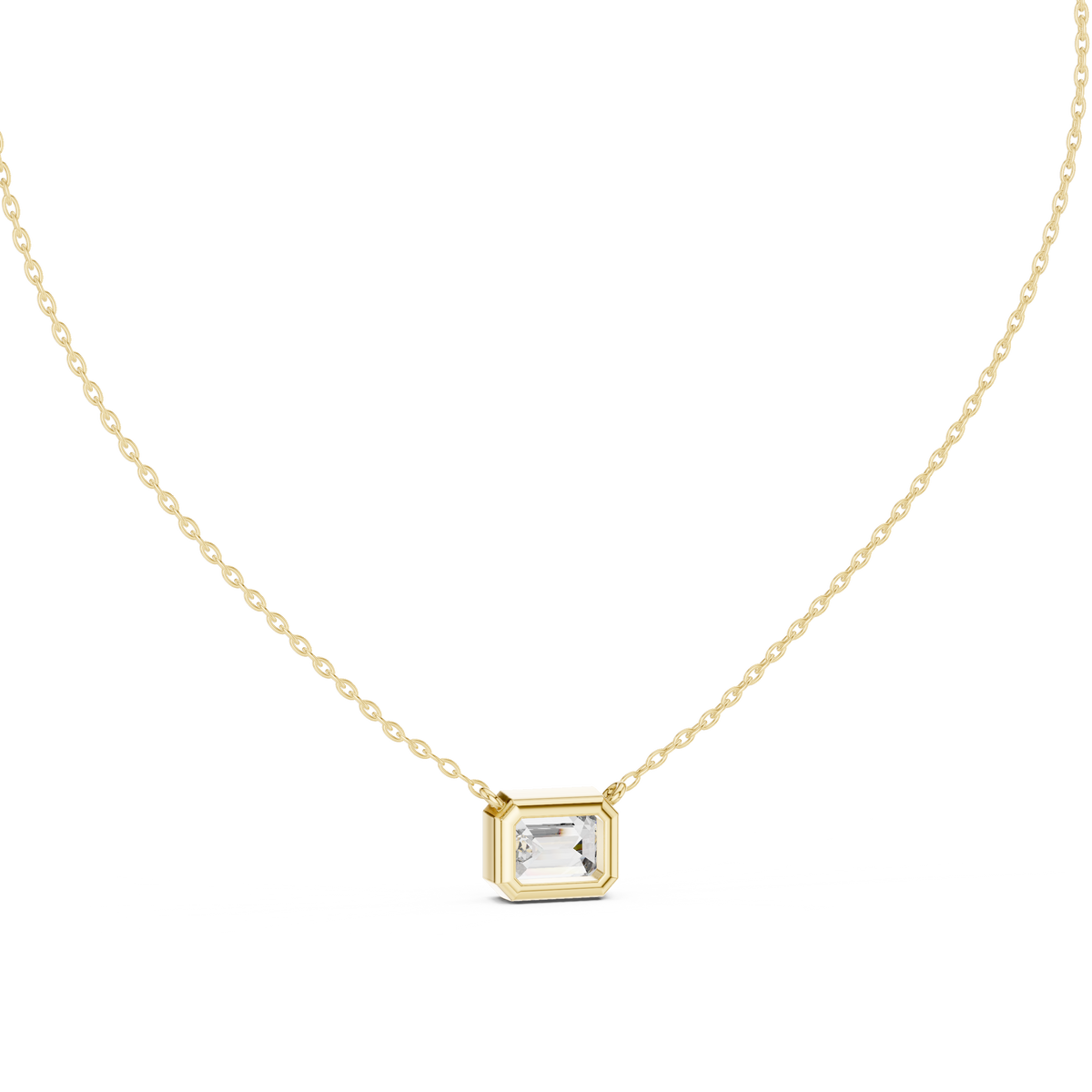 Top close-up CAD view displaying D color, VS clarity, stone symmetry, precision facets, and bezel setting details for a custom emerald pendant available in platinum, 14k gold, 10k gold, or 925 silver.