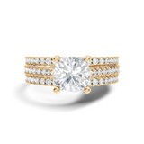 Front angle of a cushion cut main stone set in 14k gold with a triple row pave band and four claw prongs. Ideal as an engagement ring or anniversary gift, fully customizable in 10k/14k gold, 925 silver, or platinum with stone options from 1ct to 2ct in moissanite or lab grown diamond.