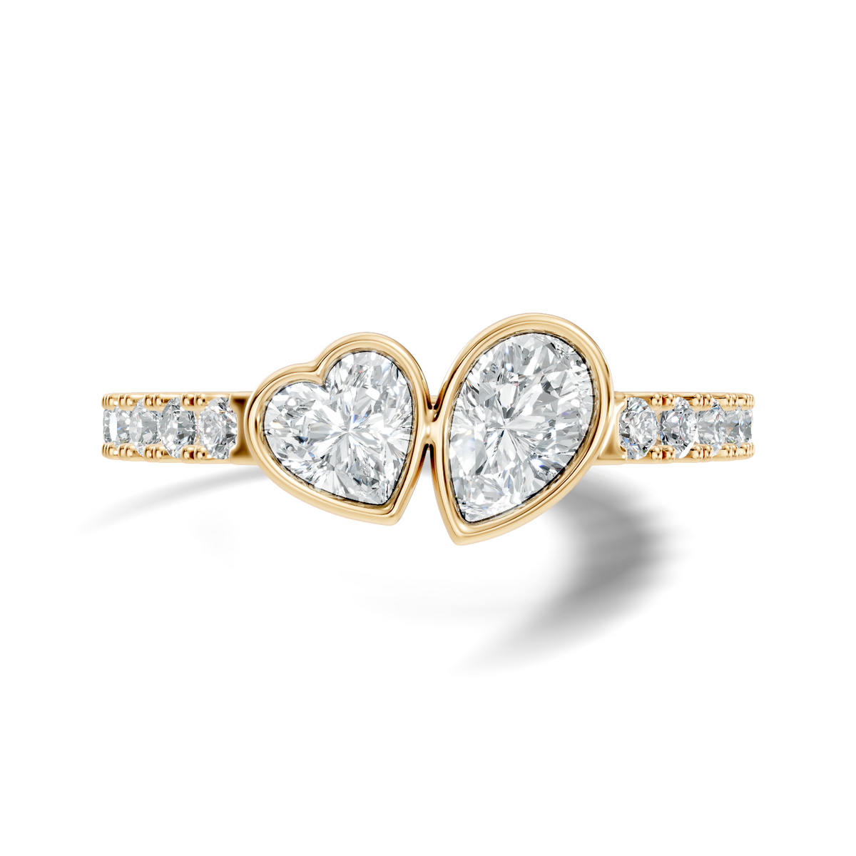 Front view showing bezel-set Pear and heart lab diamonds on a 14k gold micro-pave band. Modern toi et moi engagement ring design perfect for an anniversary gift. Customizable in 925 silver, 10k or 14k solid gold, and platinum with stone sizes from 1ct to 2ct in moissanite or lab grown diamond options.