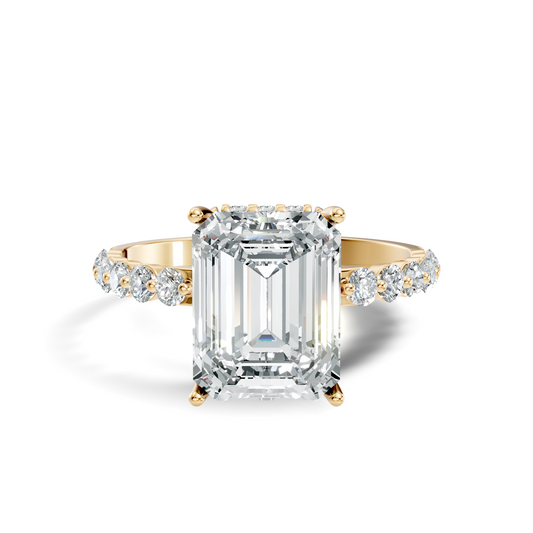 Front view of an emerald cut lab grown diamond solitaire engagement ring in 14k yellow gold with a micro pave band. This classic cathedral ring is customizable in 10k/14k gold, 925 silver, or platinum with lab grown diamond or moissanite center stones from 1ct to 2ct.