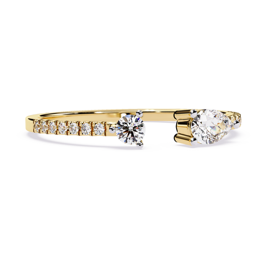 Front angle view of an open bypass toi et moi ring featuring pear and round lab grown diamonds in 14k white gold. This customizable engagement ring and anniversary gift option is available in 10k/14k gold, 925 silver, or platinum with lab grown diamond or moissanite stones from 1ct to 2ct.