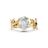 Front angle of an oval cut main stone set in 14k gold with four claw prongs and a leaf accent bypass vine band. Ideal as an engagement ring or anniversary gift, fully customizable in 10k/14k gold, 925 silver, or platinum with stone options from 1ct to 2ct in moissanite or lab grown diamond.